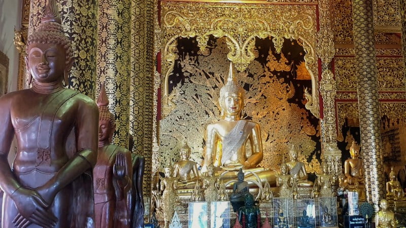 Buddha images in a prayer hall at Wat Ban Den